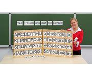 Magnetischer Buchstabensatz im Holzkoffer .